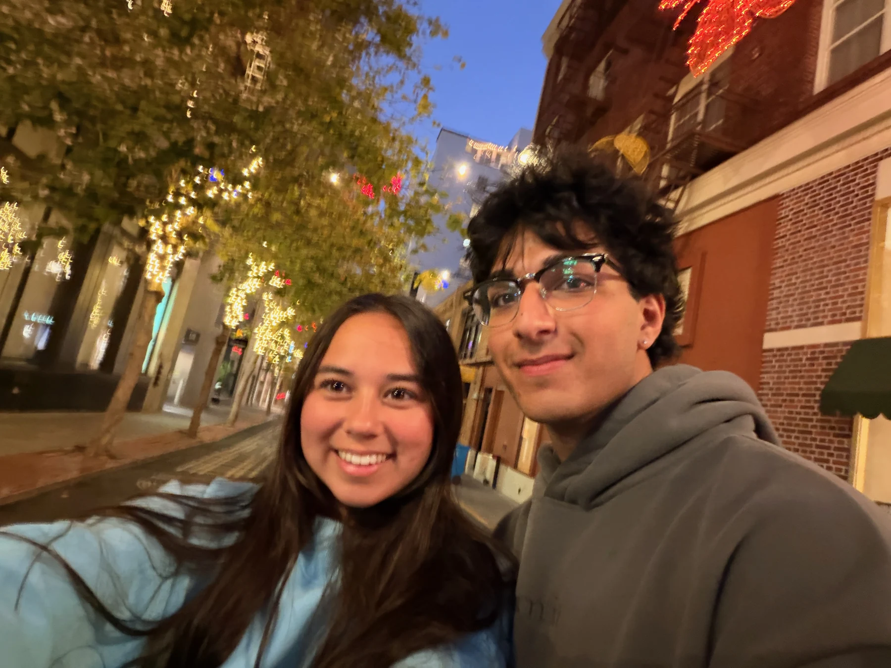 Our selfie on a softly lit city street