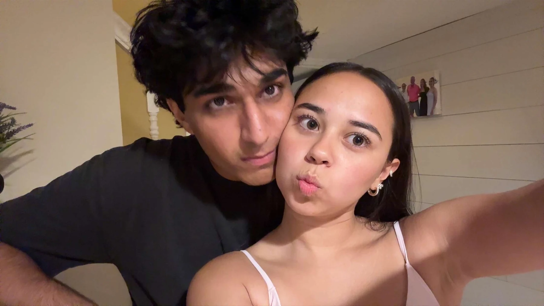 Us taking a playful close-up selfie together